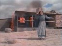 Who acts in front of the burning building.